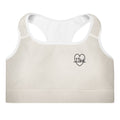 Front view of the Lord and Armor Taking the Wins Heart sports bra in cream, small black TTW heartbeat cross heart on the left chest | Christian sports bra