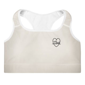 Front view of the Lord and Armor Taking the Wins Heart sports bra in cream, small black TTW heartbeat cross heart on the left chest | Christian sports bra